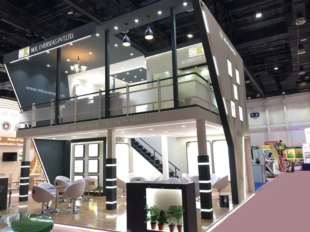Double-decker exhibition stand with staircase and glass railing, built in Dubai