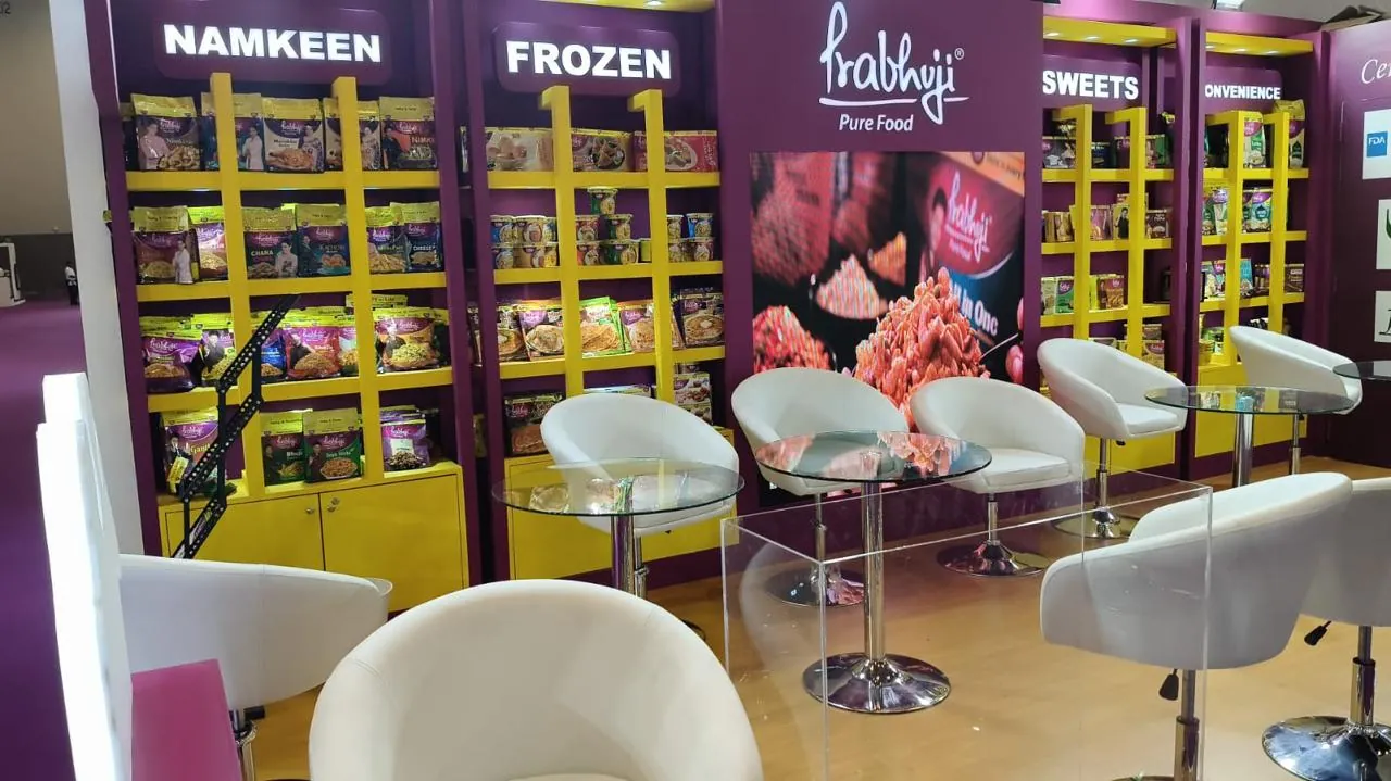 Prabhuji food stand with backlit shelving at Gulfood 2026